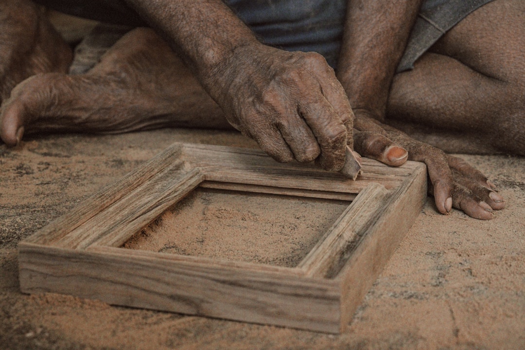 Skilled craftsperson building wooden framework structure, representing systematic capability documentation