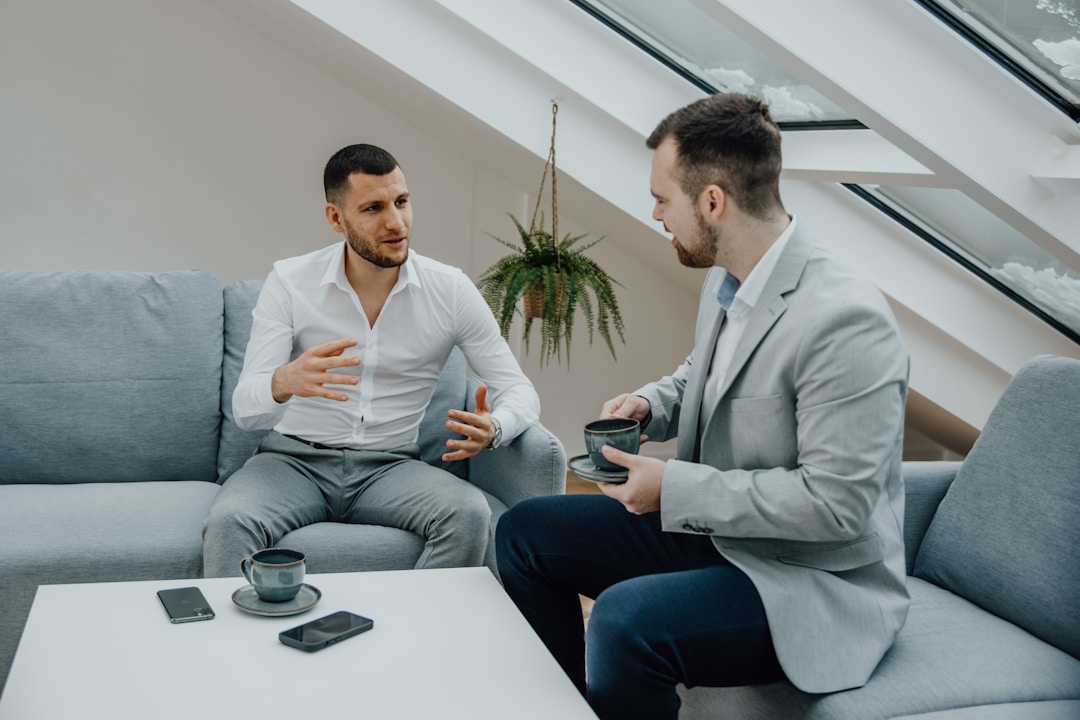 Finance executive being interviewed, reviewing financial statements with concentrated focus