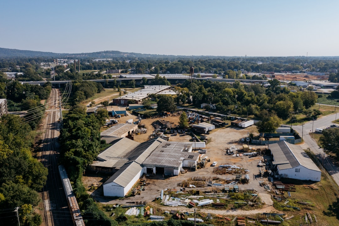 Modern manufacturing facility interior with specialized equipment and industrial infrastructure highlighting location dependency