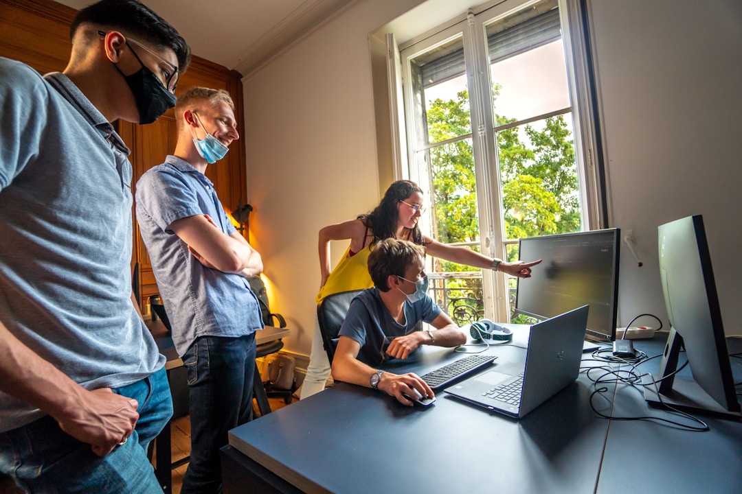 Employees working collaboratively on manufacturing or assembly line floor