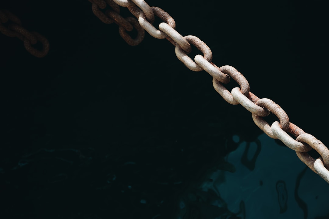 Broken chain with missing links representing institutional memory gaps and lost connections