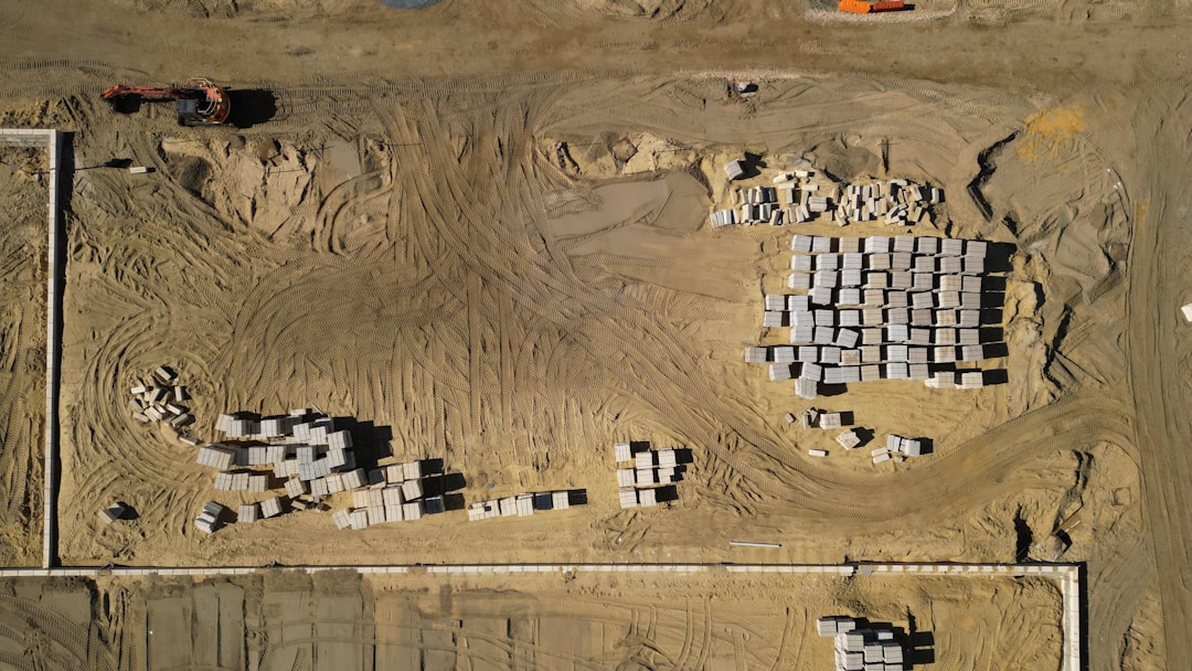 Strong architectural foundation blocks being carefully placed representing relationship infrastructure building